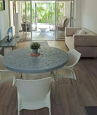 a blue table and chairs in a living room at Casa Valentina in Río San Juan