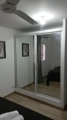 a room with a sliding glass door to a bedroom at Casa Valentina in Río San Juan