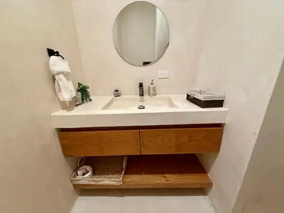 a bathroom with a sink and a mirror at Charming Villa GUGI #80 in Palmeras de Coson, Las Terrenas in Las Terrenas