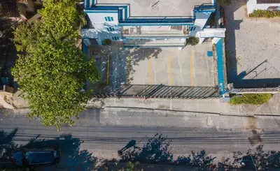 an overhead view of a street with a car on the road at beachfront apartment in La Puntica de Juan Dolio