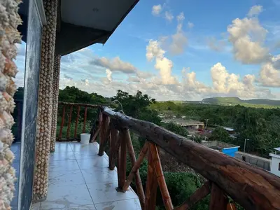 a balcony of a house with a view at Guest-House Caracol 1- 2 Pax, vista al mar in Las Galeras
