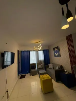 a living room with a couch and a tv at Cozy apartment in Licey al Medio in Licey al Medio