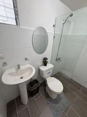 a bathroom with a toilet and a sink and a mirror at Cozy apartment in Licey al Medio in Licey al Medio
