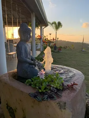 a statue of a woman sitting in a fountain at Villa Brisa del Caribe in Las Terrenas