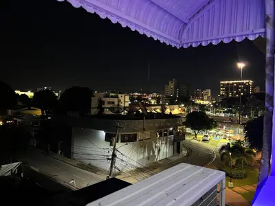 a view of a city at night with a building at Style and comfort in downtown Santiago in Santiago de los Caballeros