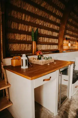 a kitchen with a wooden counter with a sink at OYA New Earth Private Jungle Cabin with Individual Campfire in Jamao al Norte