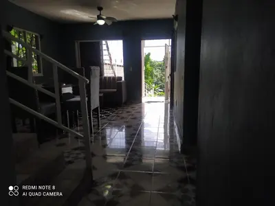 a hallway with a door open to a room at Recidencia Don Carlos