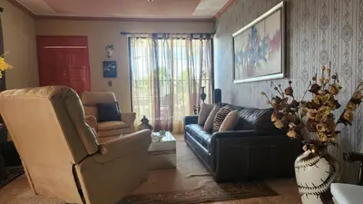 a living room with a couch and chairs and a table at Casa club by mama nelsy in Santa Cruz de El Seibo