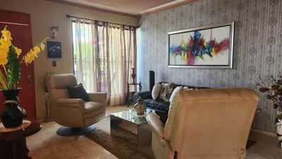 a living room with a couch and chairs and a table at Casa club by mama nelsy in Santa Cruz de El Seibo