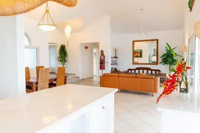 a living room with a couch and a table at Villa Playa Colorada Eco-Luxury Beachfront Retreat in La Colmena