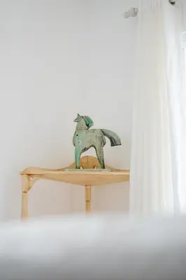 a statue of a dog on a wooden shelf at Villa Playa Colorada Eco-Luxury Beachfront Retreat in La Colmena
