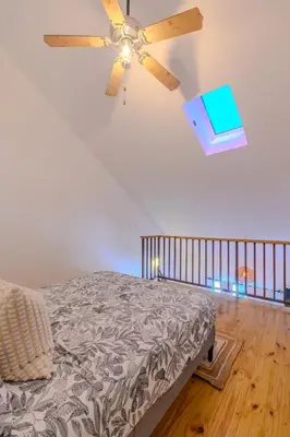 a bedroom with a ceiling fan and a bed at Esprit Caribbean Bayahibe by Caribbean Paradise Rentals in Bayahibe