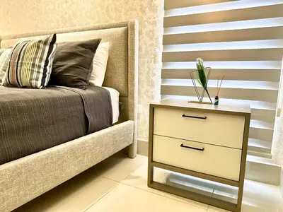 a bedroom with a bed and a night stand with a drawer at Suite Panorama in Colorado