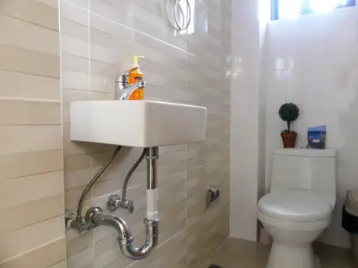 a bathroom with a sink and a toilet at Acogedor y Familiar in Colorado