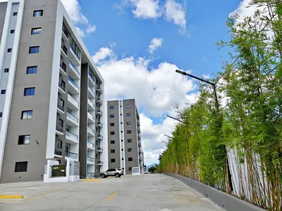 an empty parking lot with two tall buildings at Acogedor y Familiar in Colorado