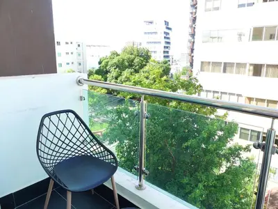 a blue chair sitting on a balcony with a view at Con Estilo Soha II in Colorado
