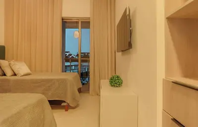 a hotel room with two beds and a balcony at Villa Privada + Piscina | Playa & Golf in Punta Cana