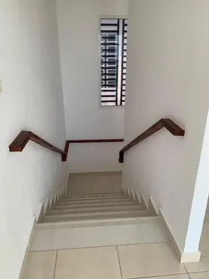 a staircase in a white room with a window at Seaside Elegance in Baní
