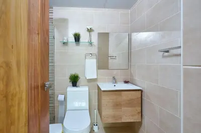 a bathroom with a toilet and a sink at Erasmo in Colorado