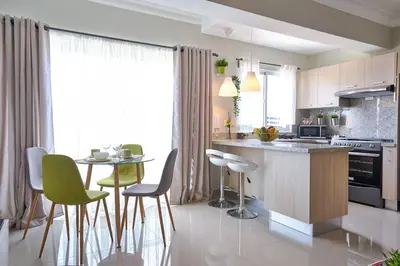 a kitchen with a counter and a table and chairs at Erasmo in Colorado