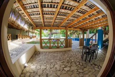 an internal view of a house with a wooden ceiling at Hotel la Saladilla Beach Club in Santa Cruz de Barahona