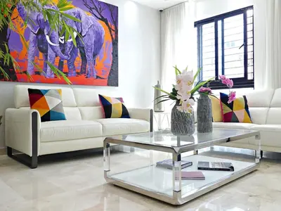 a living room with a white couch and a glass table at Villa Olga Premium in Colorado