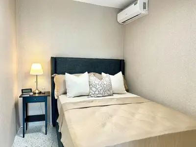 a small bedroom with a bed and a night stand at Mini Hogar 4 in Colorado