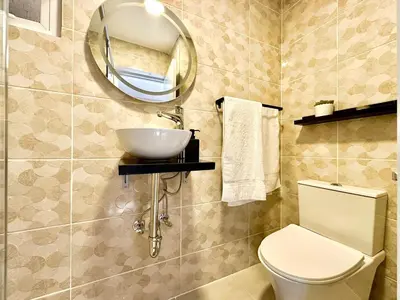 a bathroom with a sink and a toilet and a mirror at Mini Hogar 4 in Colorado