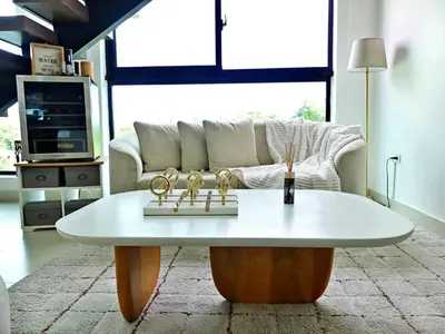 a coffee table in a living room with a couch at Elegante y Amplio in Colorado