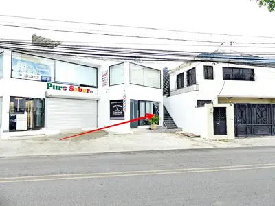 a white building with a red pole in front of it at Mini Hogar 2 in Colorado