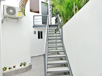 a staircase leading up to a white house at Mini Hogar 3 in Colorado