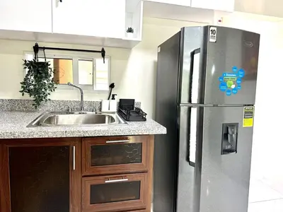 a kitchen with a stainless steel refrigerator and a sink at Vista Central in Colorado