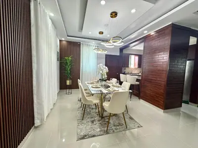 a dining room with a table and white chairs at Casa Elegante in Colorado