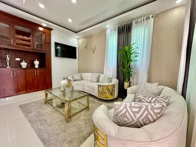 a living room with a couch and a table at Casa Elegante in Colorado