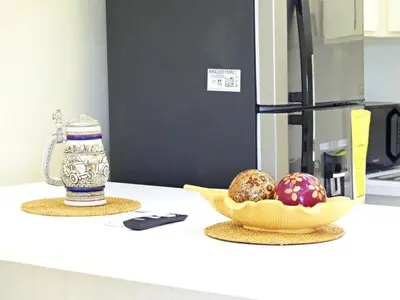 a kitchen counter with a bowl of food and a bottle at Luperon Cerca del Mar in Colorado