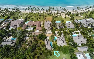 an aerial view of a resort with houses and the beach at Nomadas 5 bdrs villa with private pool 2nd line to beach in Las Terrenas