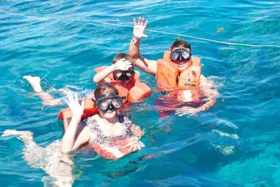 a group of people in the water at Modern Apartment in Bayahibe in Bayahibe