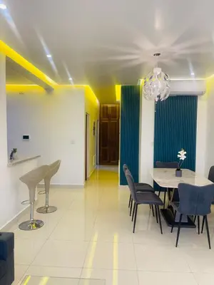 a dining room with a table and chairs at Sunset Residences 3BR, Pool & Beach Cosita Rica in Puerto Plata