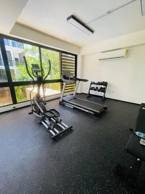 a gym with two treadmills and a treadmill at Sunset Residences 3BR, Pool & Beach Cosita Rica in Puerto Plata