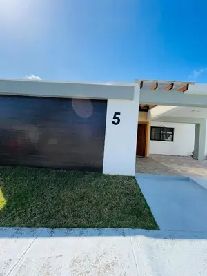 a house with the number on the side of it at Modern 3BR with private pool near the beach in Puerto Plata