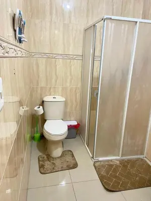 a bathroom with a toilet and a shower at Modern 2BR Condo Near the Beach Juan Dolio in Villas del Mar