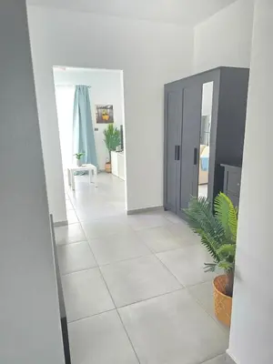 a hallway with a door and a tile floor at Estrella Condos 8min walk to the beach Studio 201A in La Laguna