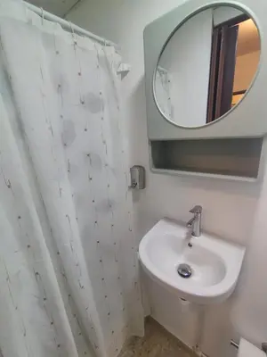 a bathroom with a sink and a mirror at La Guarida de Mela in Santo Domingo