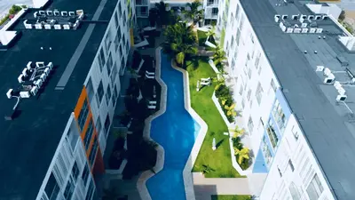 an aerial view of a building with a swimming pool at Apartment in Punta Cana