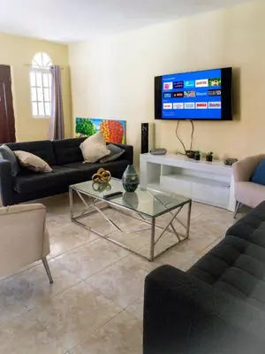 a living room with a couch and a table at 4BR Villa Newly Renovated-5 min to Playa Dorada H1 in San Felipe de Puerto Plata