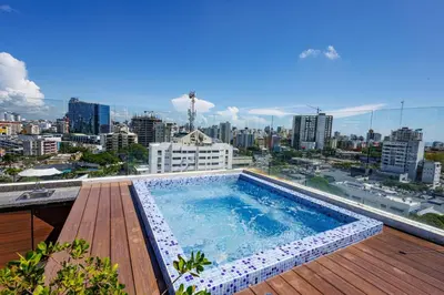 a swimming pool on the roof of a building at Upscale City Center Condo, Pool, Gym in Santo Domingo