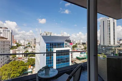 a balcony with a view of a city at Upscale City Center Condo, Pool, Gym in Santo Domingo