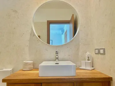 a bathroom with a white sink and a mirror at Villa Hazel in Las Terrenas