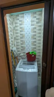 a washing machine with a pot on top of it at Mitaly apartamentos Santo Domingo G in Santo Domingo