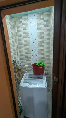a small refrigerator with a pot on top of it at Mitaly apartamentos Santo Domingo G in Santo Domingo
